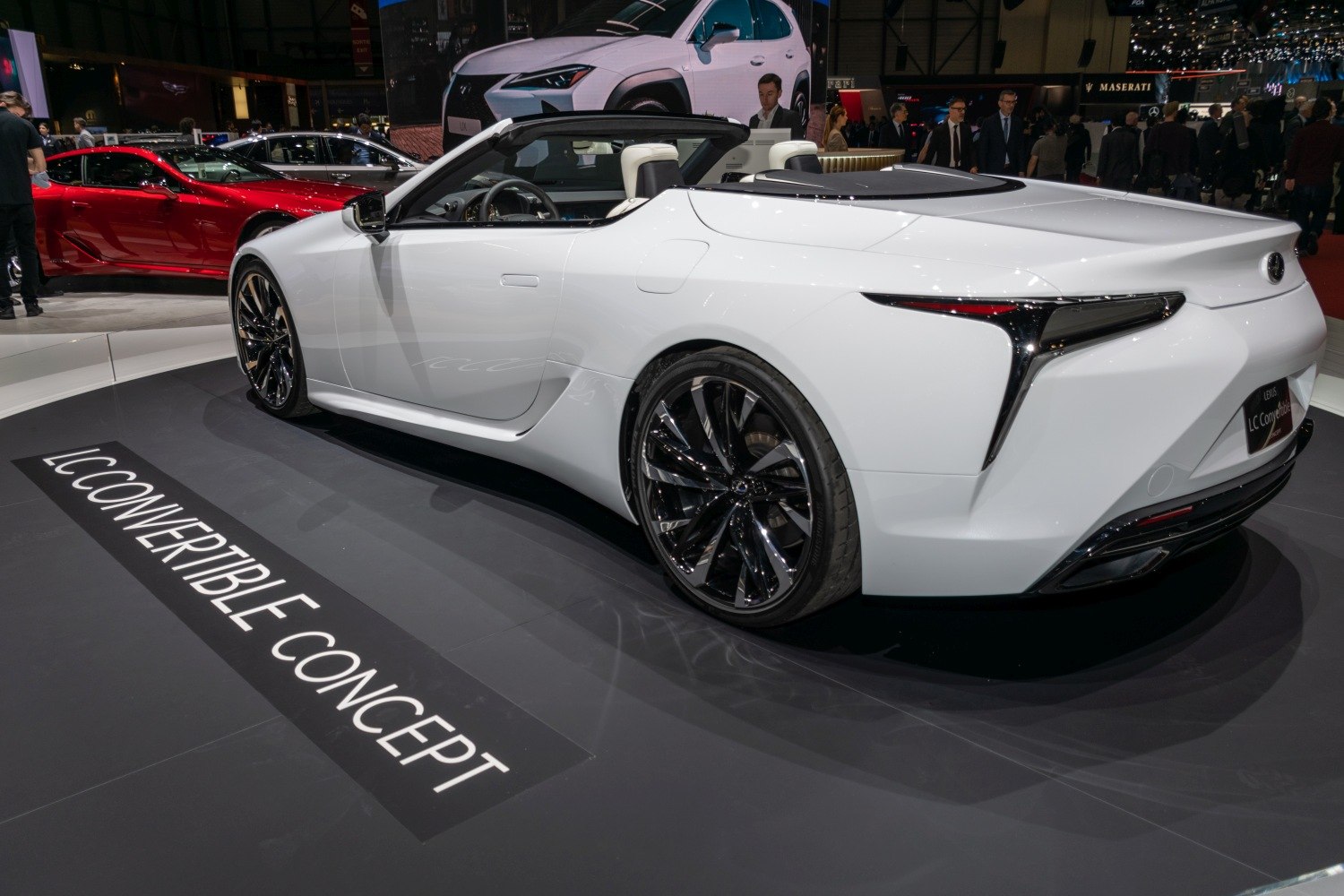 Rear side view of a sleek convertible with aerodynamic curves and modern tail lights