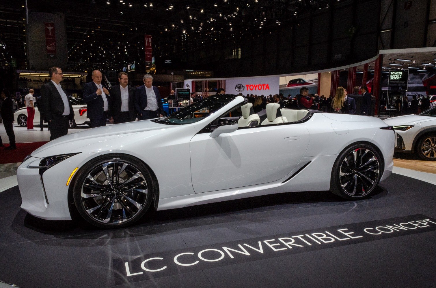 White sleek convertible with sporty wheels and elegant design
