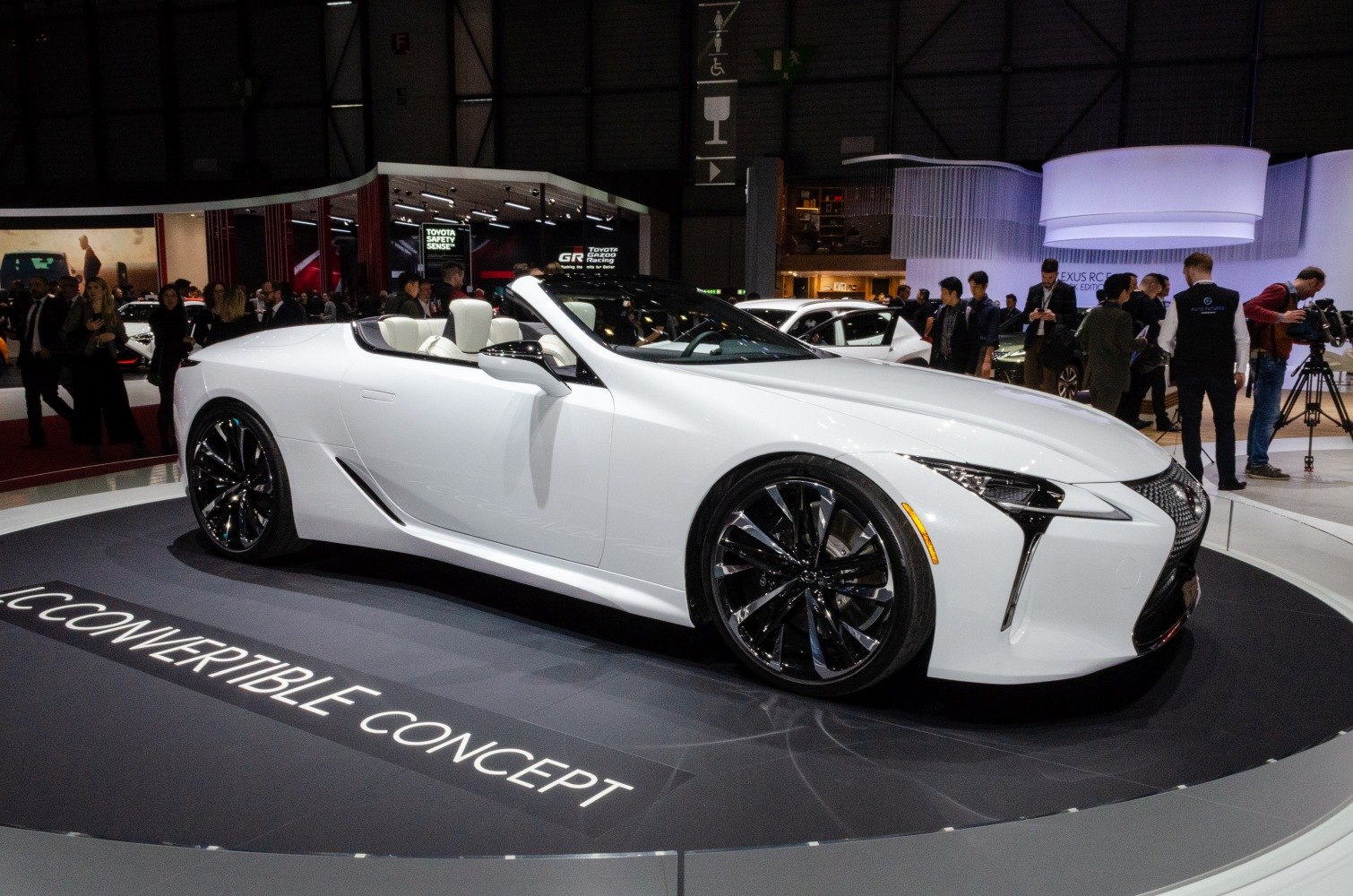 White luxury convertible with black rims and sleek roadster design