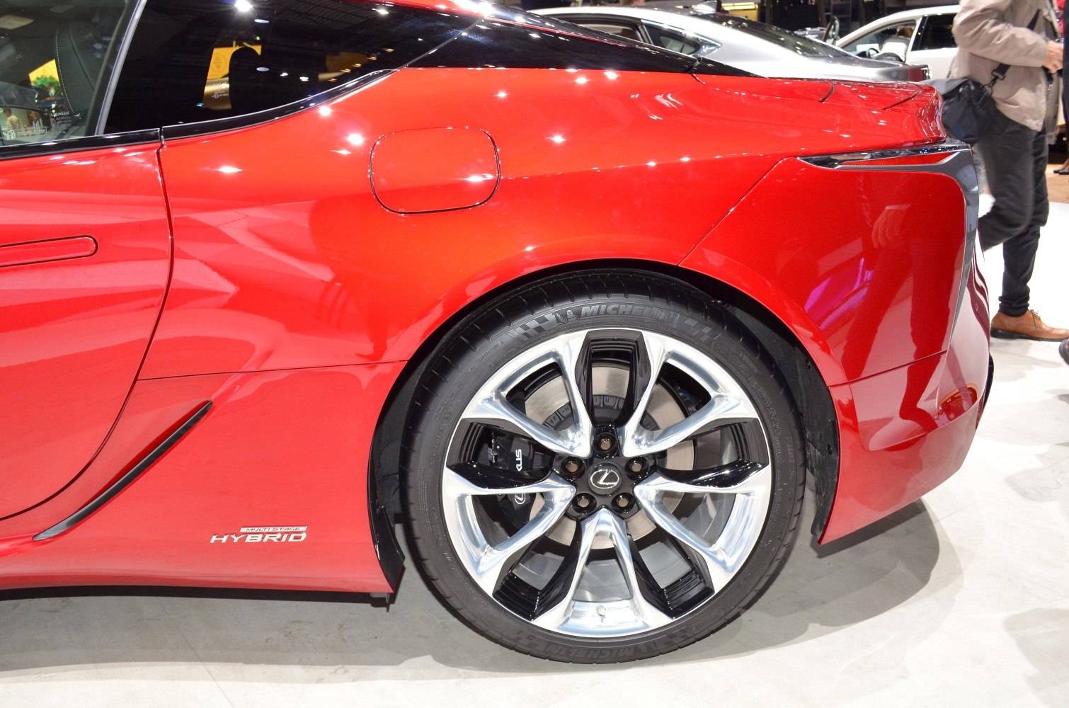Close-up of rear side and alloy wheel of hybrid sports coupe