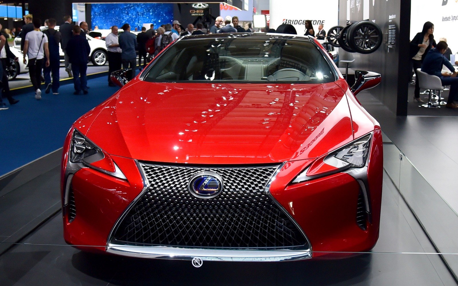 Front view with sharp LED headlights and large mesh grille