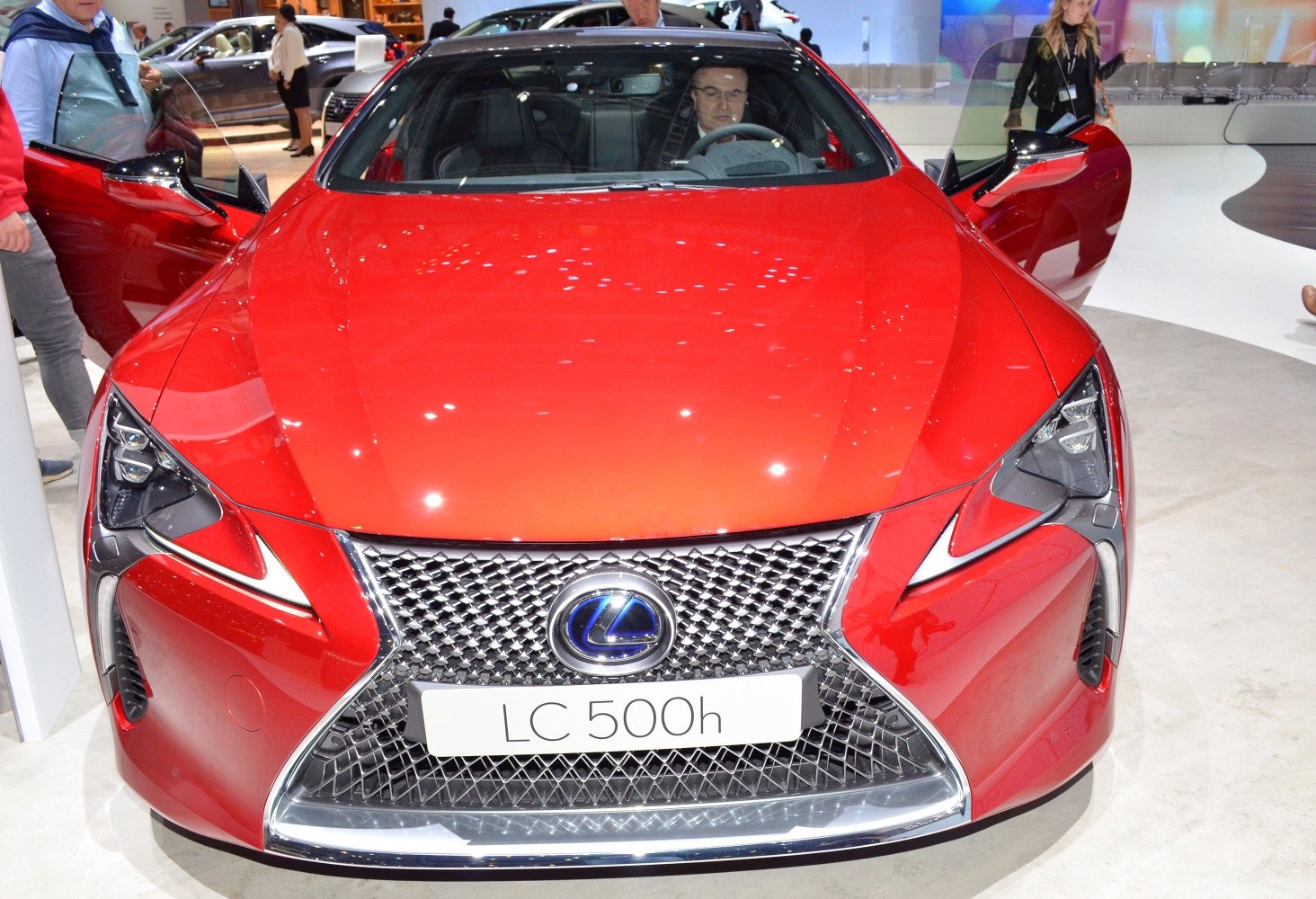 Front grille and sharp headlights of luxury coupe