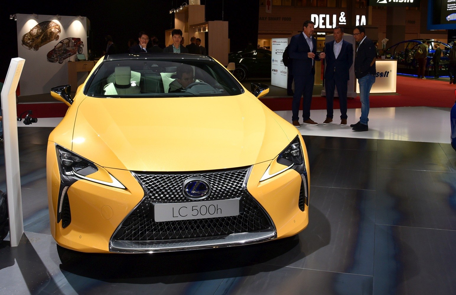 Front view with LED headlights and large mesh grille