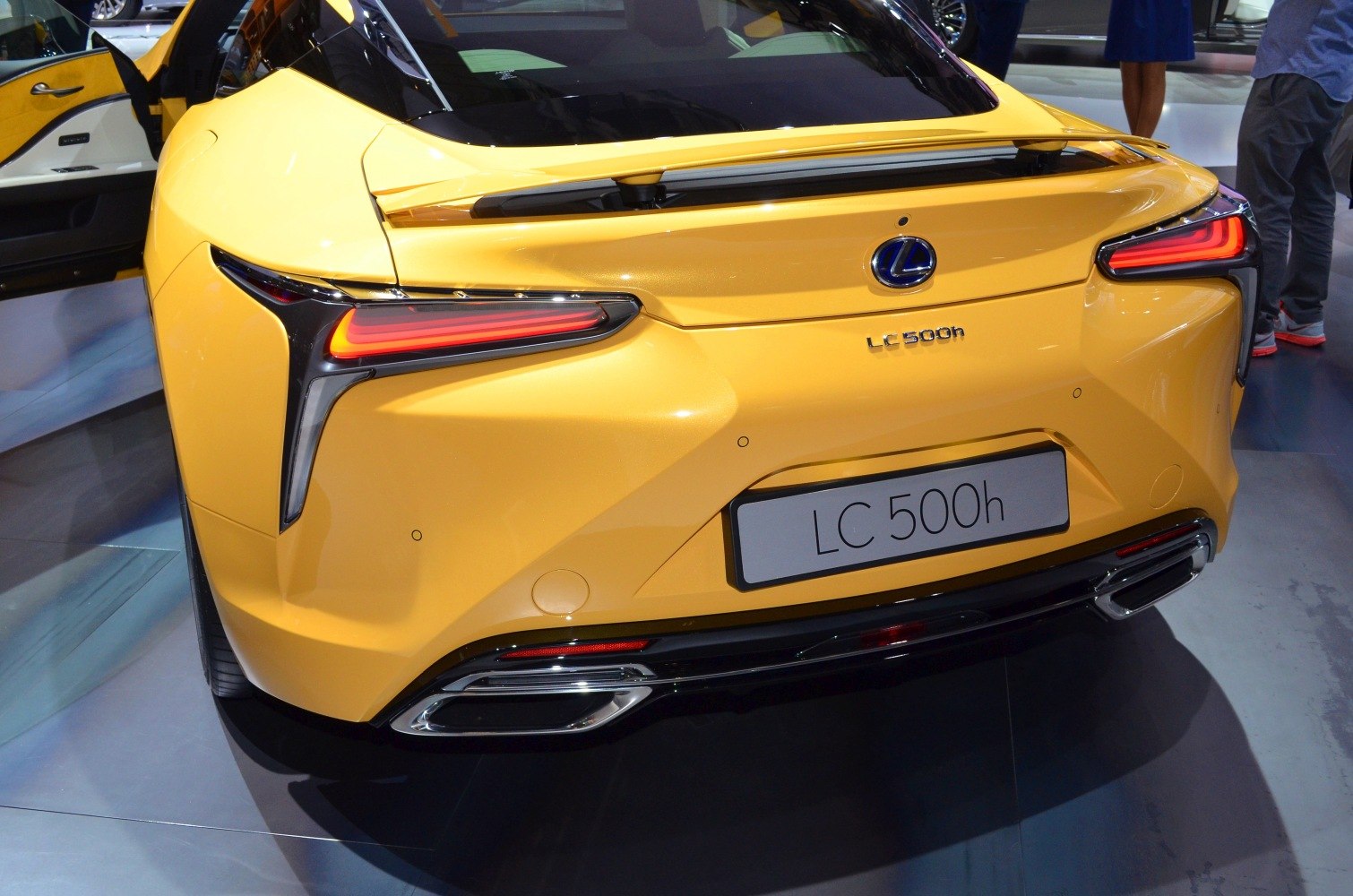 LED tail lights and dual exhausts on a luxury coupe rear