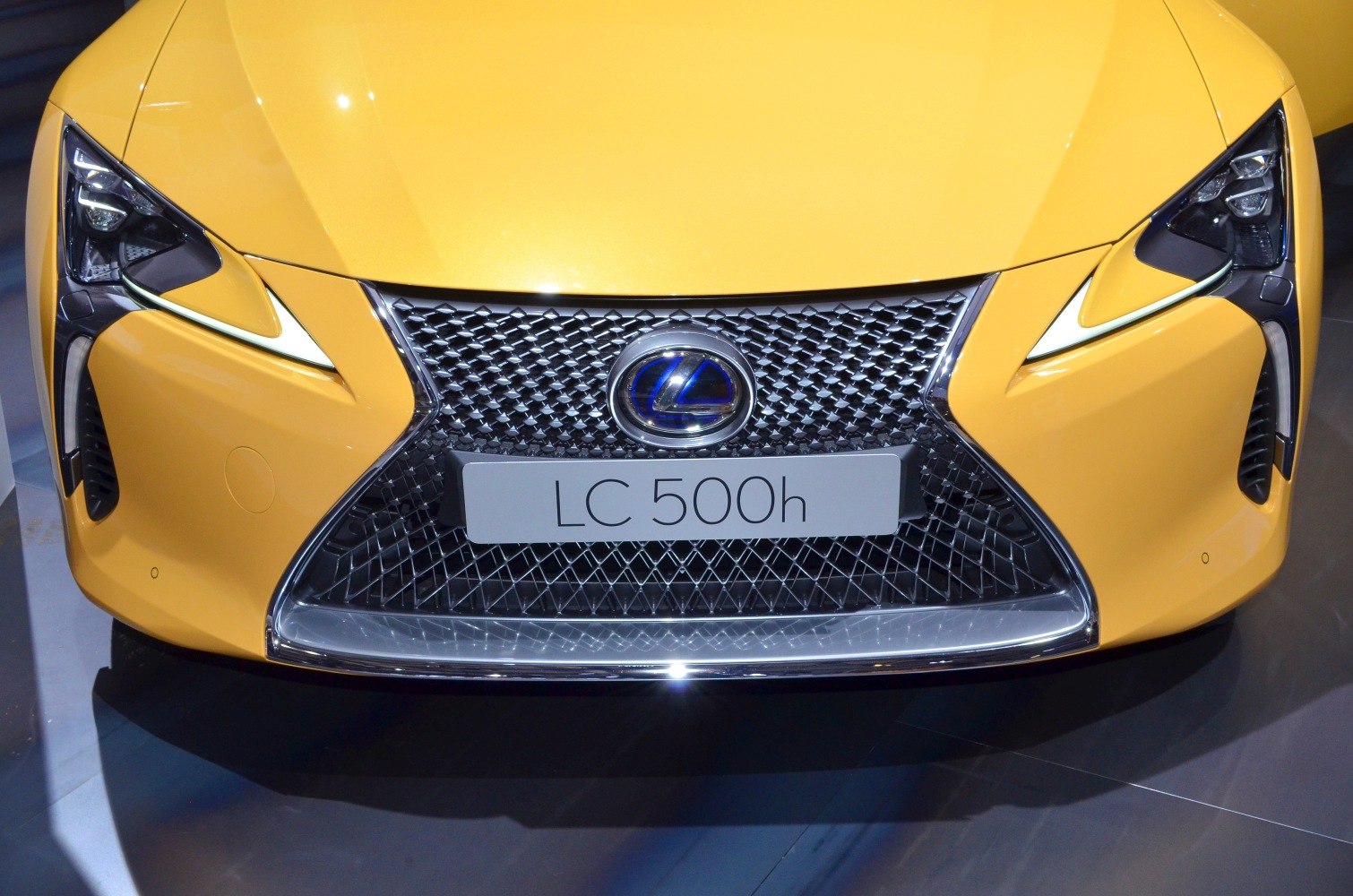 Front grille and sleek headlights of a luxury sports coupe