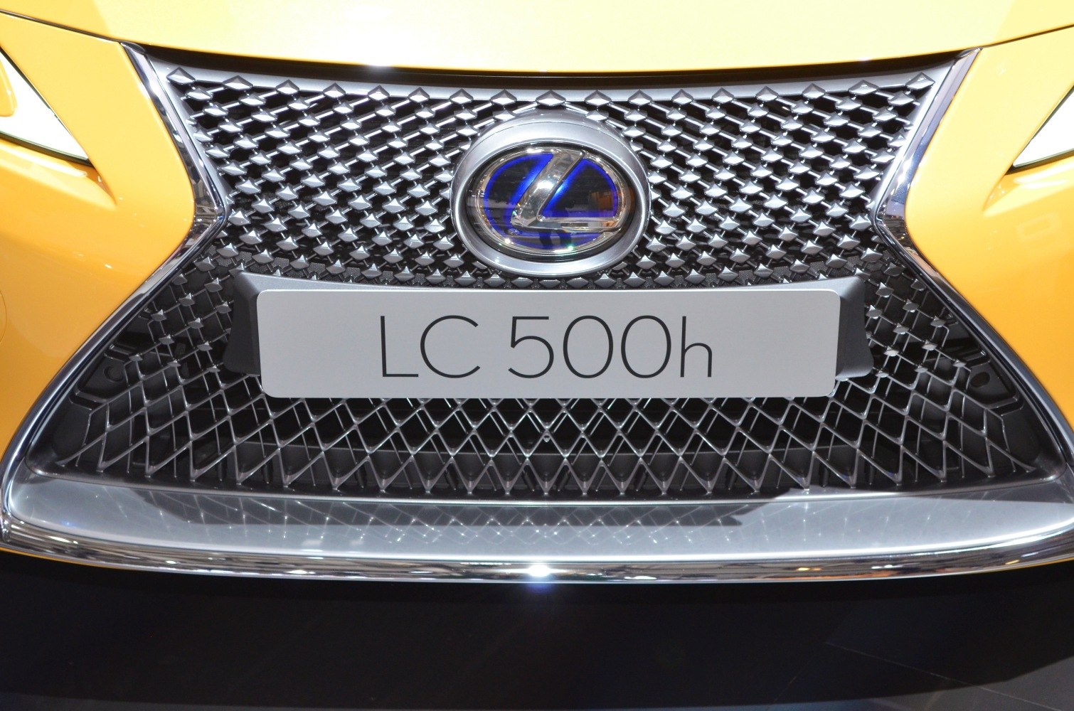 Close-up of Lexus LC 500h front grille and hybrid badge