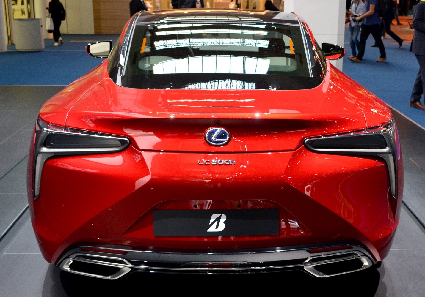 Rear view with distinctive tail lights and twin exhaust outlets.