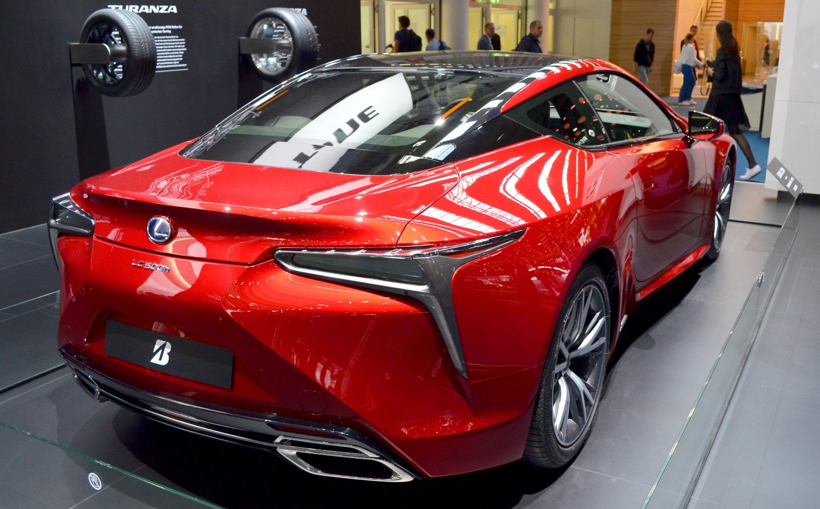 Aerodynamic rear view with sharp tail lights and dual exhausts