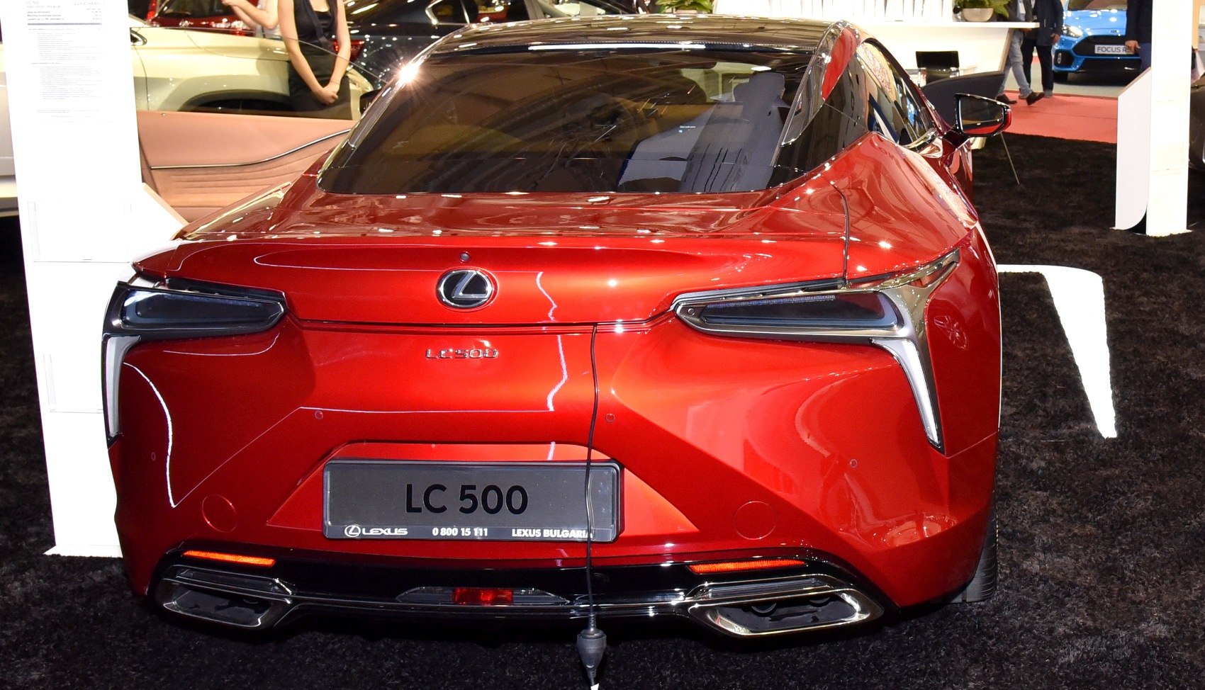 Sleek rear view with distinctive tail lights and dual exhausts
