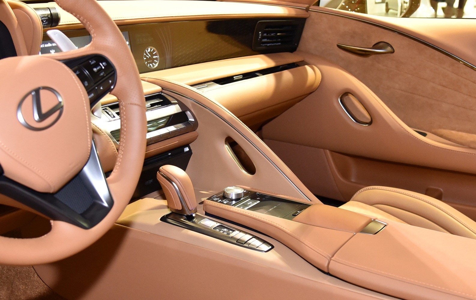 Tan leather interior with steering wheel and center console controls