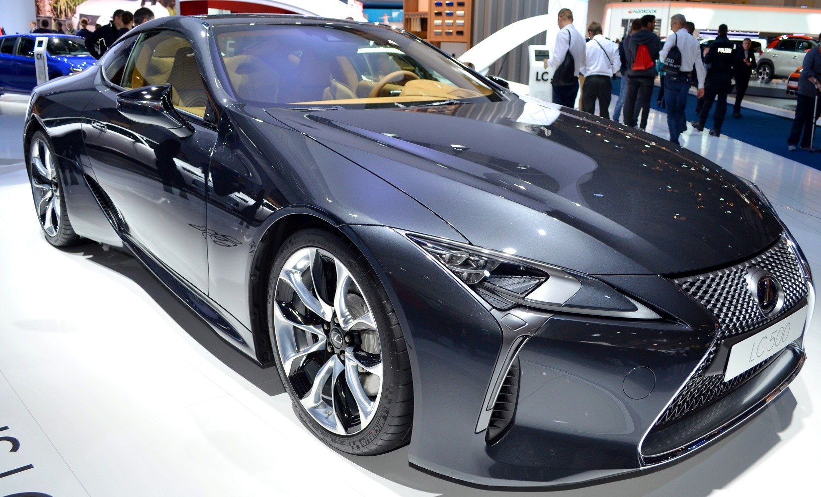 Front side view of sleek luxury coupe with alloy wheels