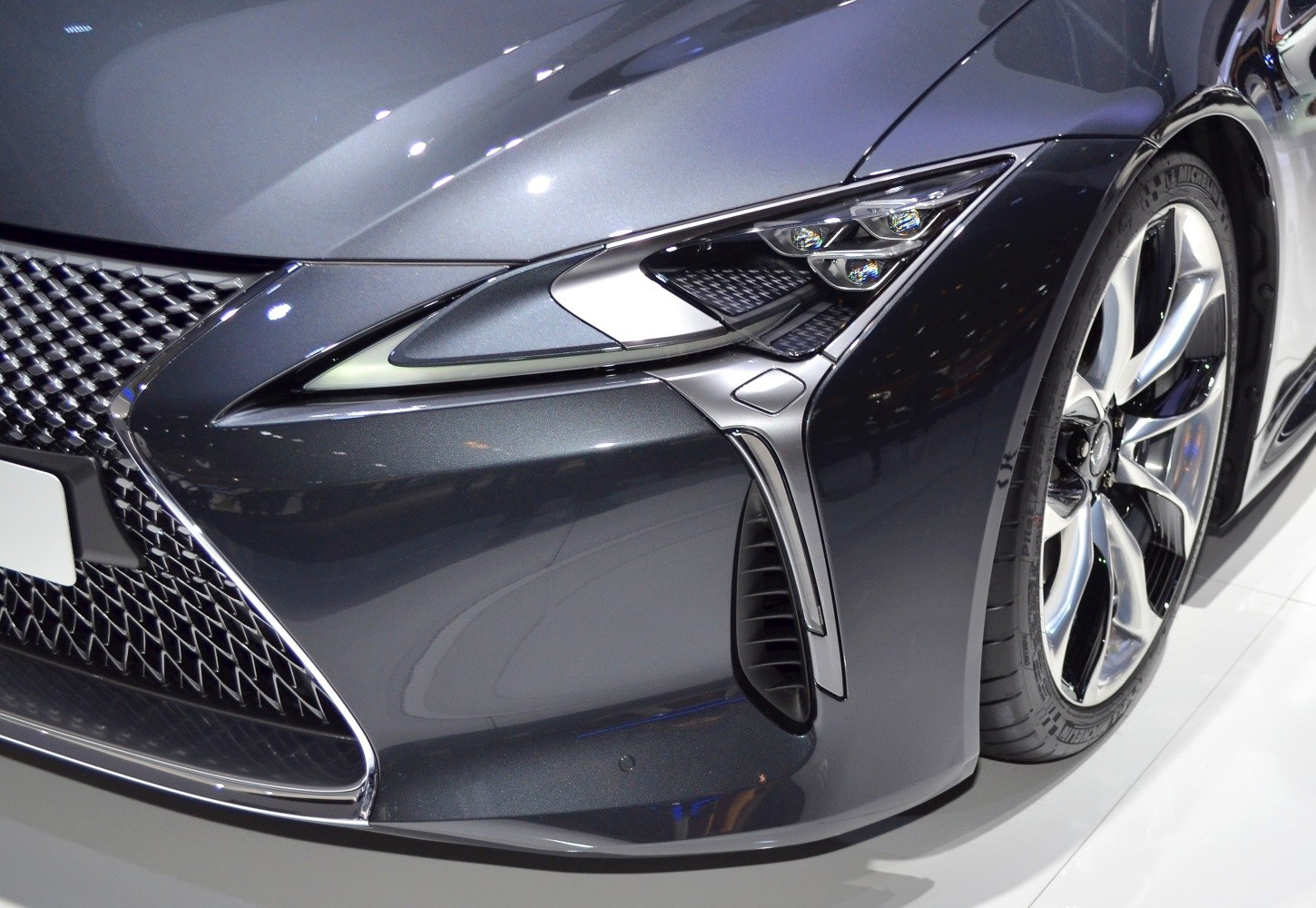 Aggressive headlight cluster and stylish alloy wheel on front end.