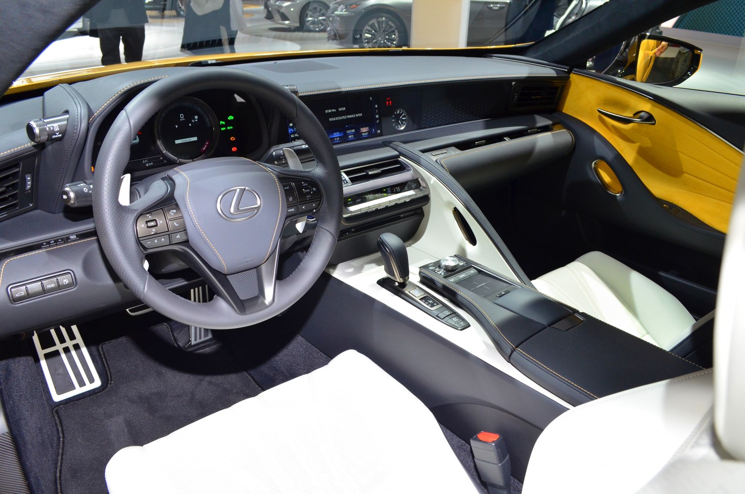 Modern luxury car interior with dashboard and steering wheel