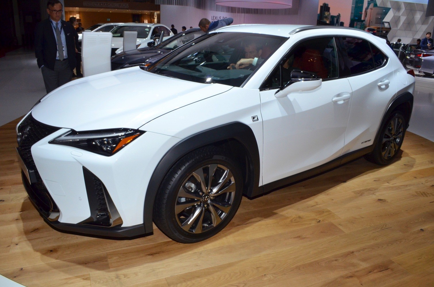 White compact hybrid SUV front-side with LED headlights and alloy wheels