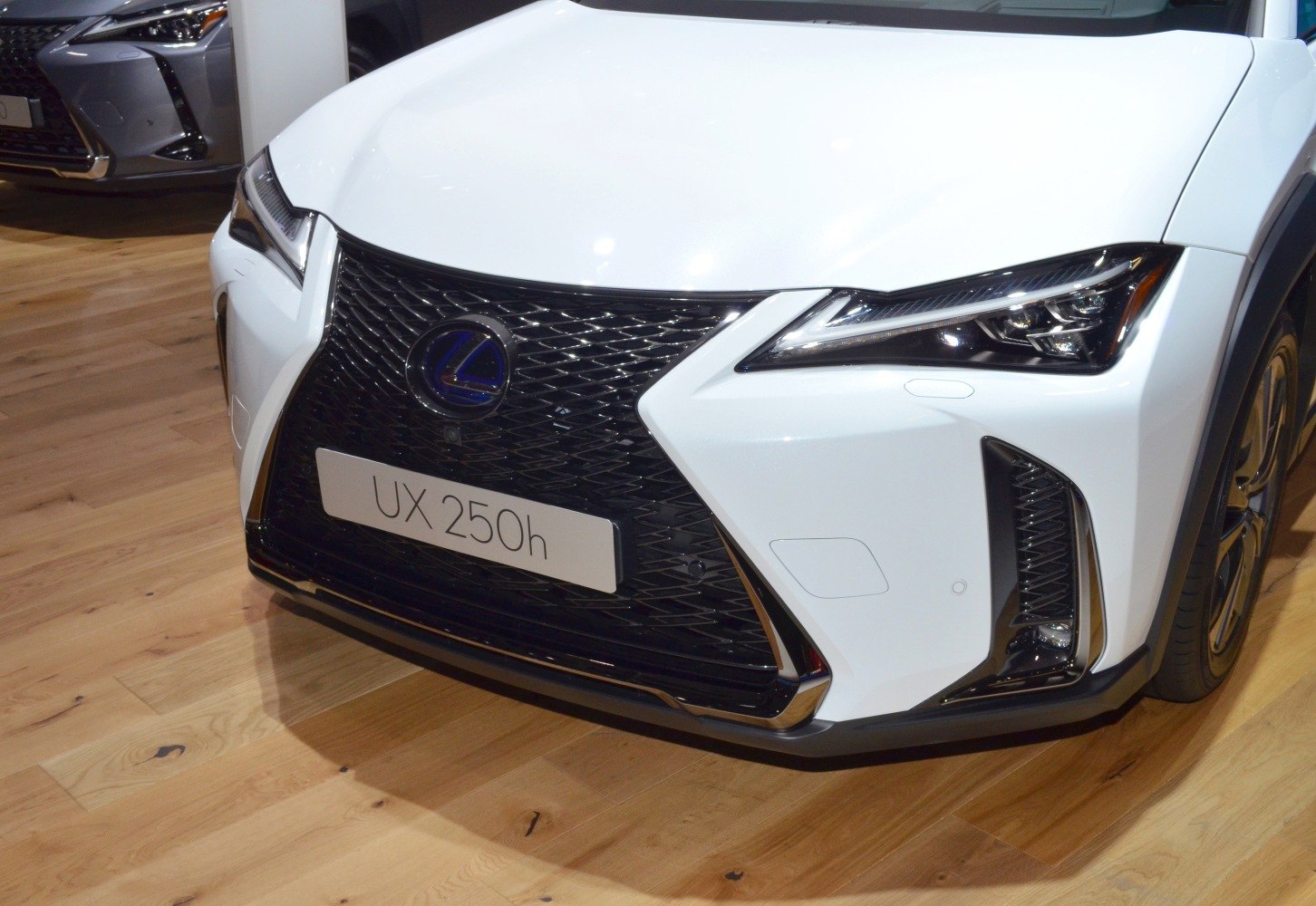 Close-up of Lexus UX 250h front grille and LED headlight