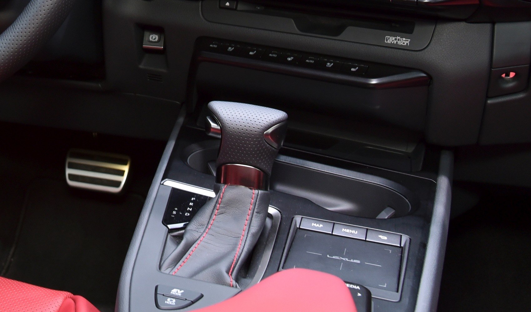 Gear shift lever with red stitching and central control touchpad