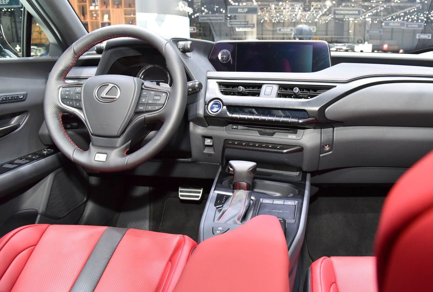 Sporty red leather seats and modern dashboard with multifunction steering wheel