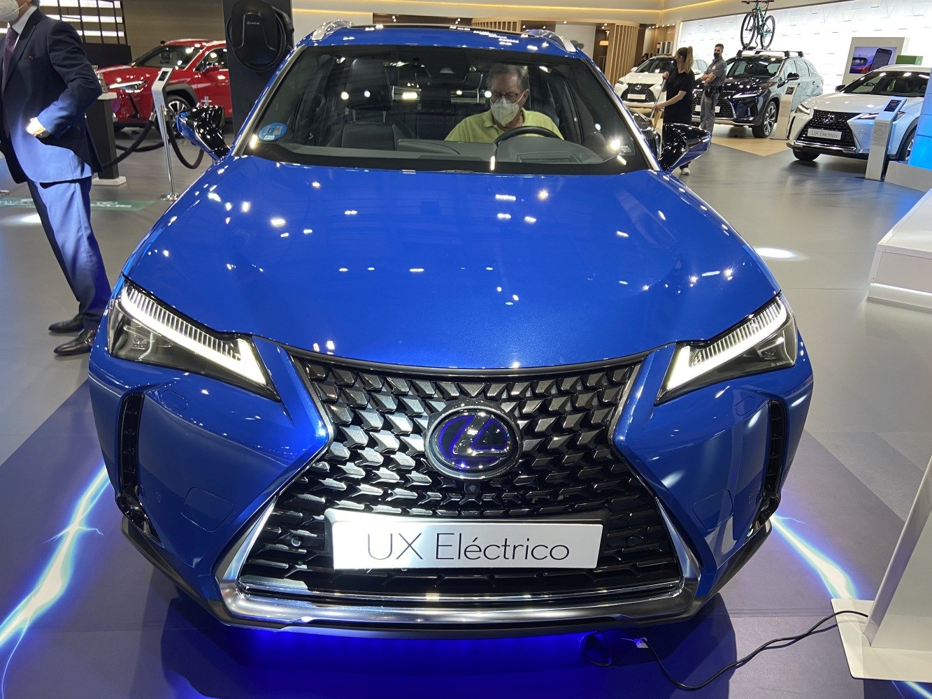 Blue electric SUV front with LED headlights and spindle grille
