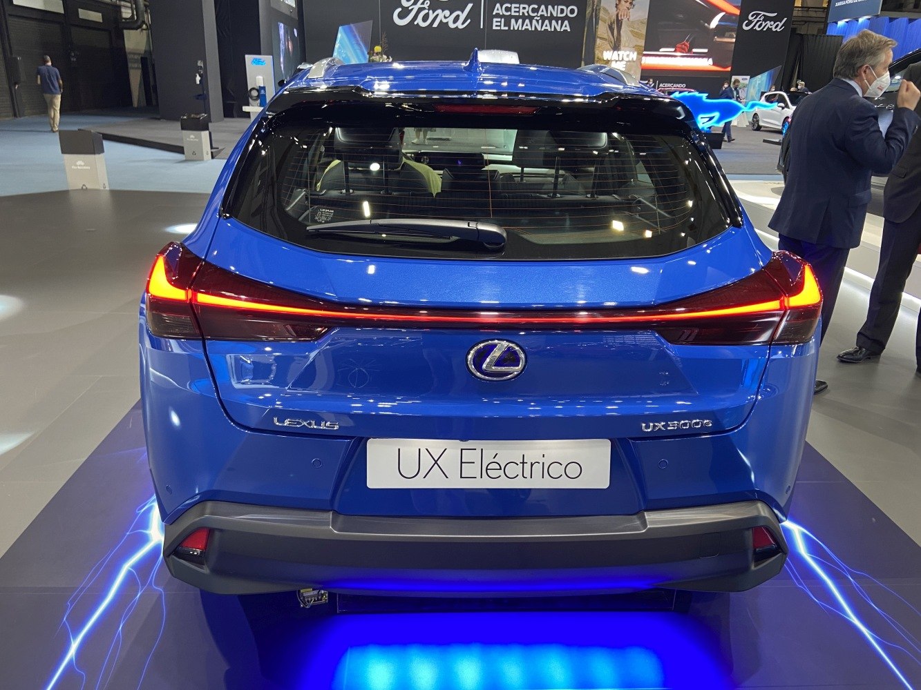 Rear view with LED tail lights and blue body of a modern electric SUV