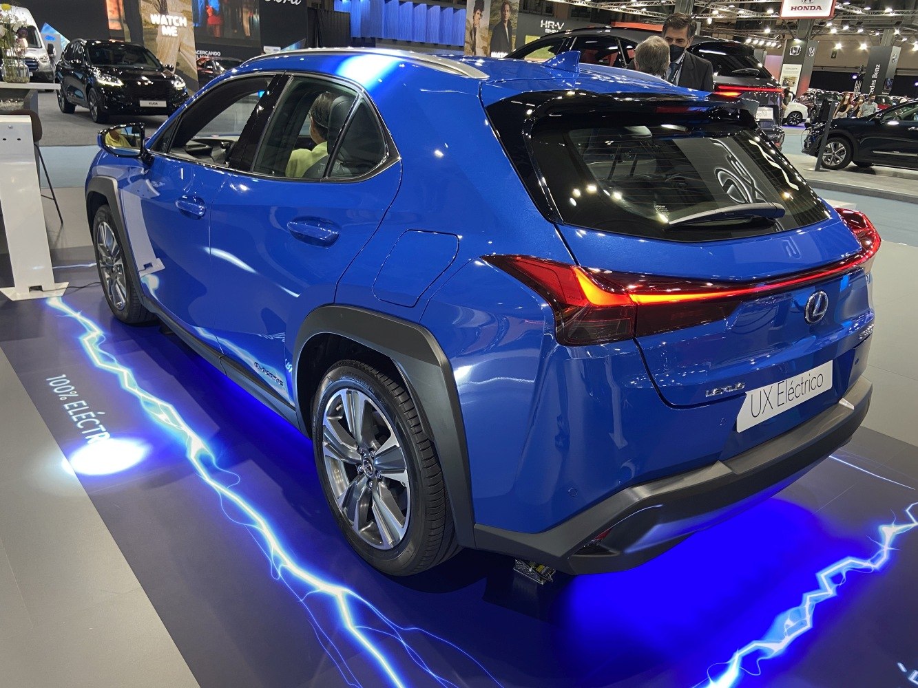 Blue electric compact SUV rear side with LED taillights and alloy wheels