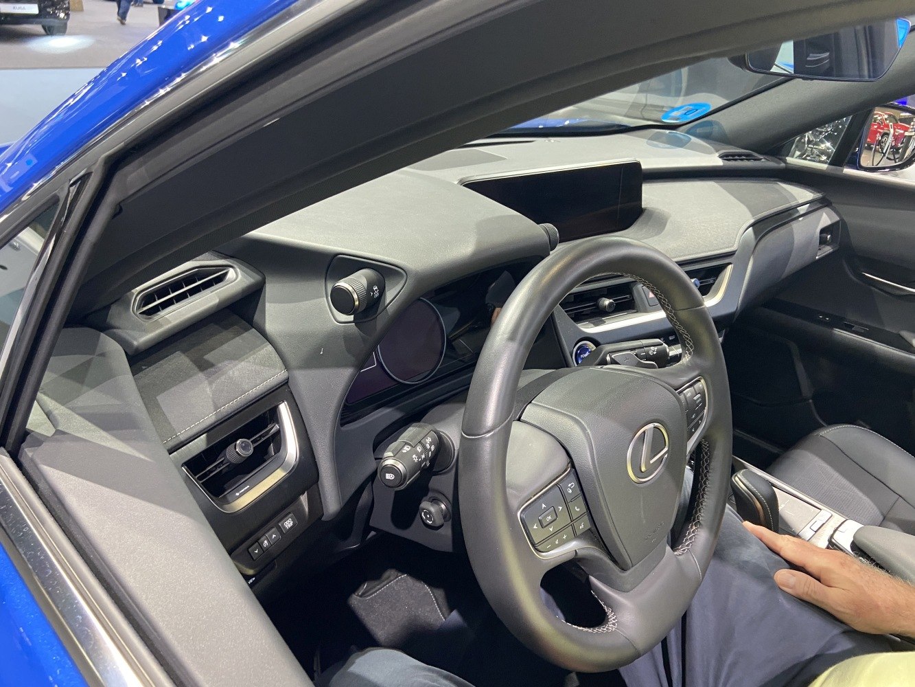 Modern luxury car interior dashboard and steering wheel with advanced controls