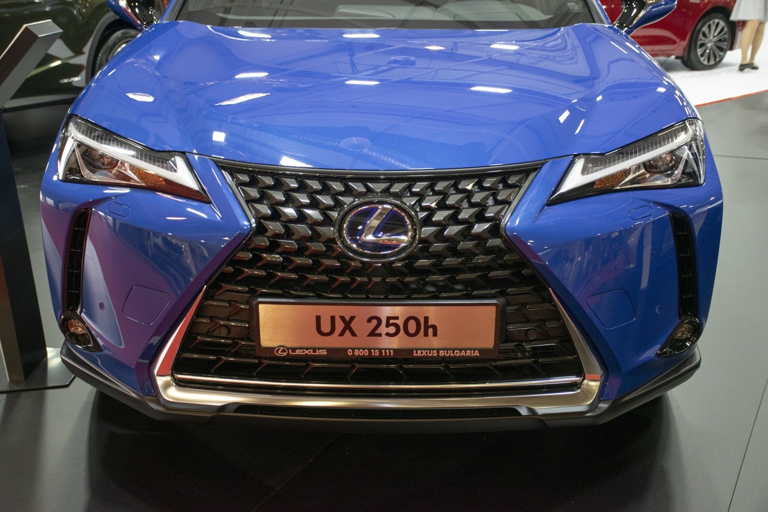 Distinctive front grille and sleek headlights of a modern luxury hybrid SUV