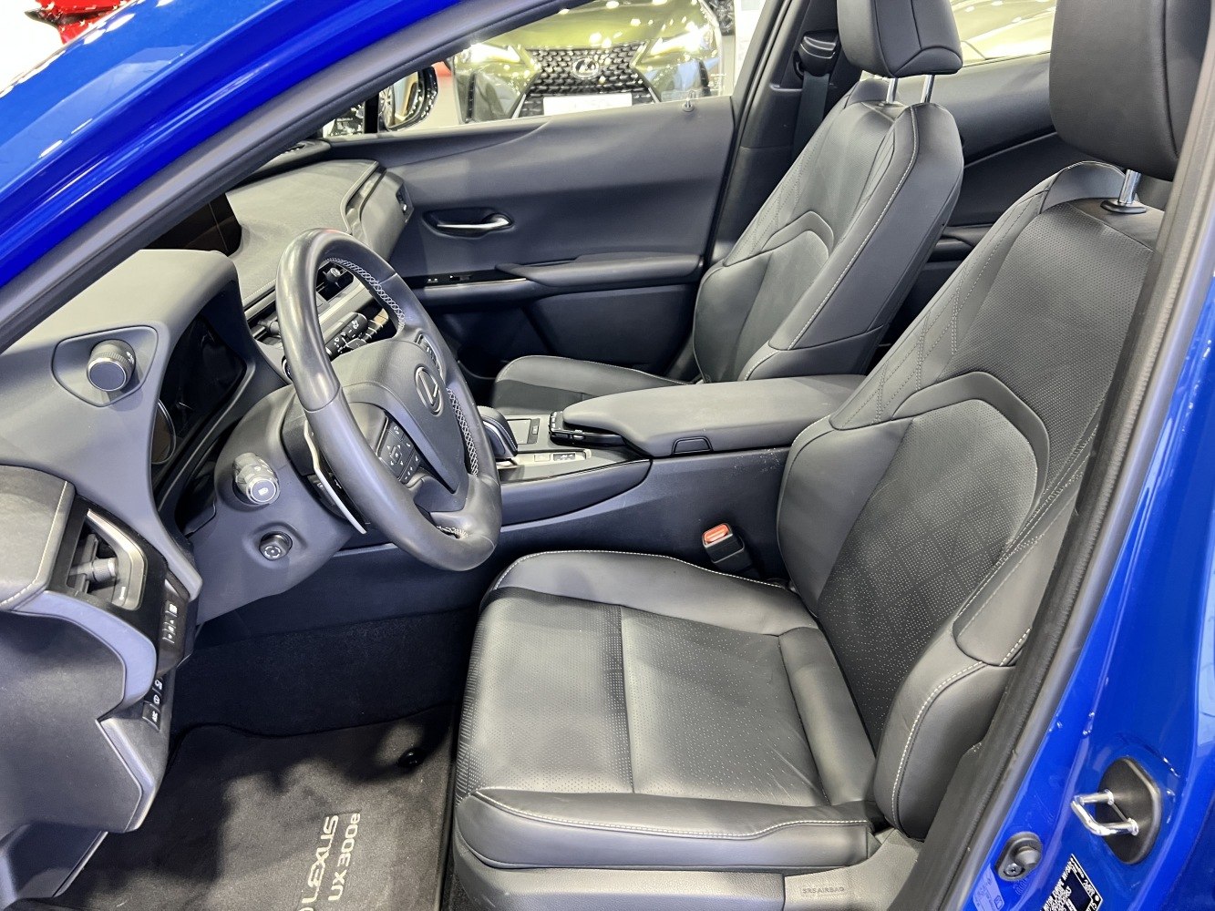 Leather seats, modern steering wheel, and sleek dashboard.