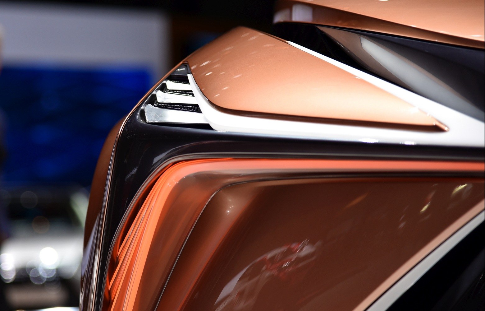 Close-up of futuristic rear light and body panel with sleek design.