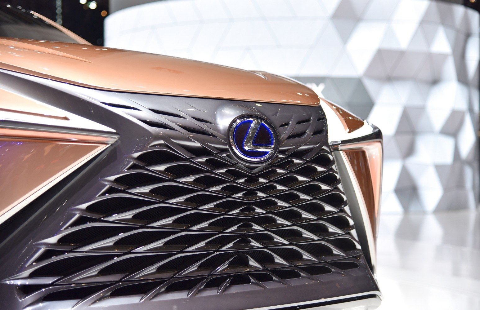 Close-up of futuristic front grille with illuminated logo