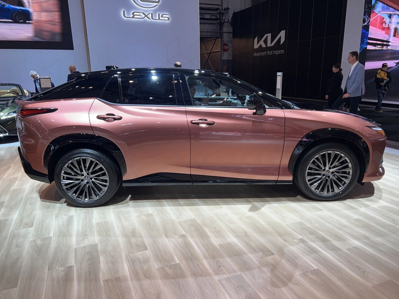 Side profile of electric SUV with two-tone roof and alloy wheels