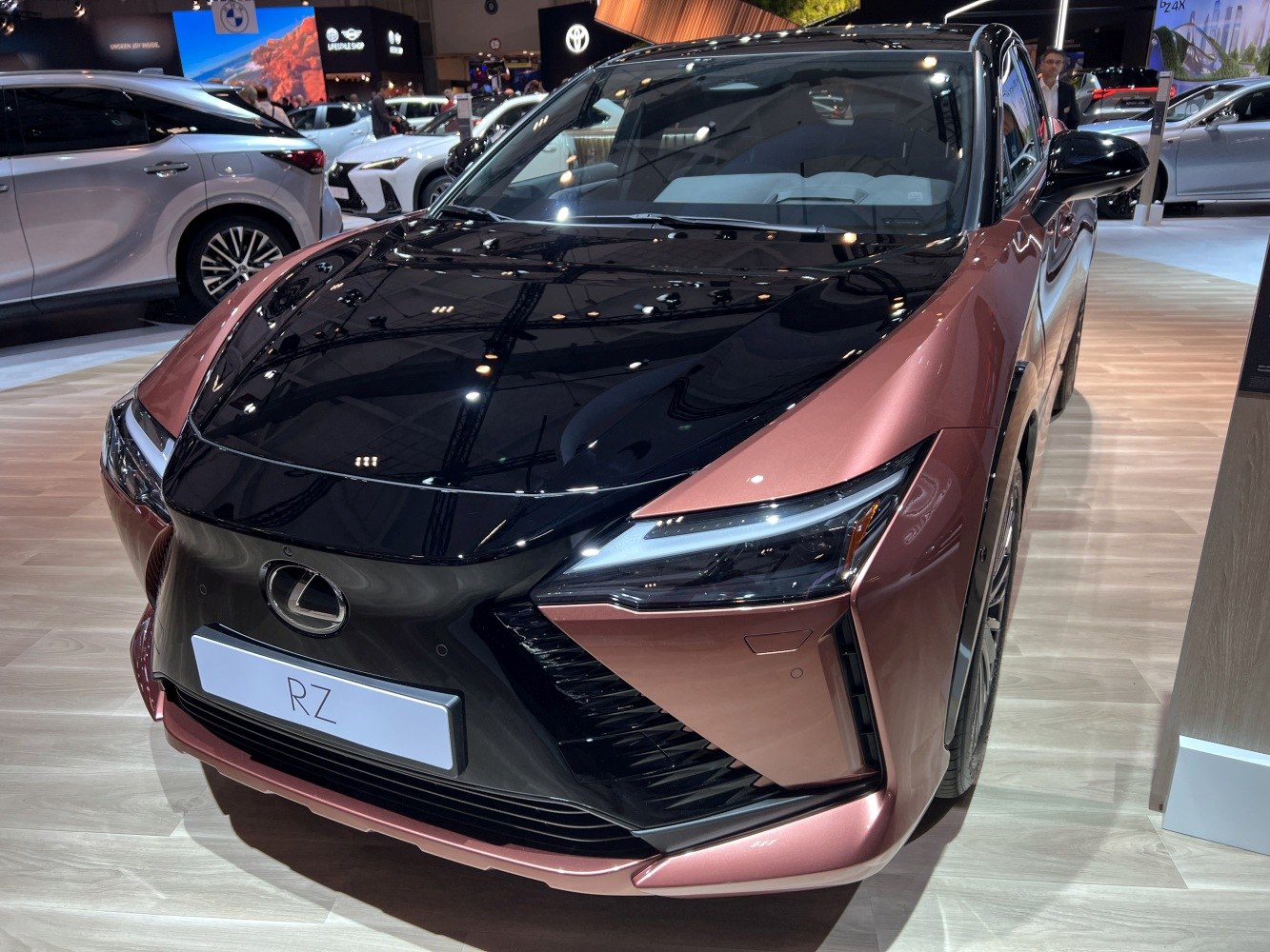 Front view with sleek LED headlights and black hood design