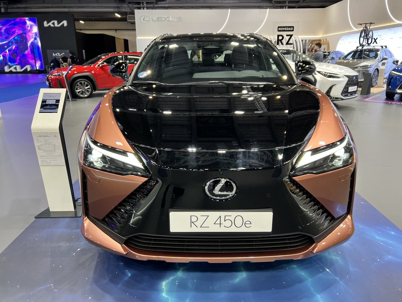 Electric SUV front with sharp LED headlights and two-tone black-copper hood