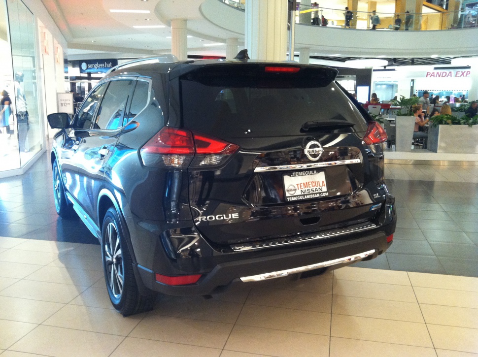 Rear view with taillights and chrome trim on SUV