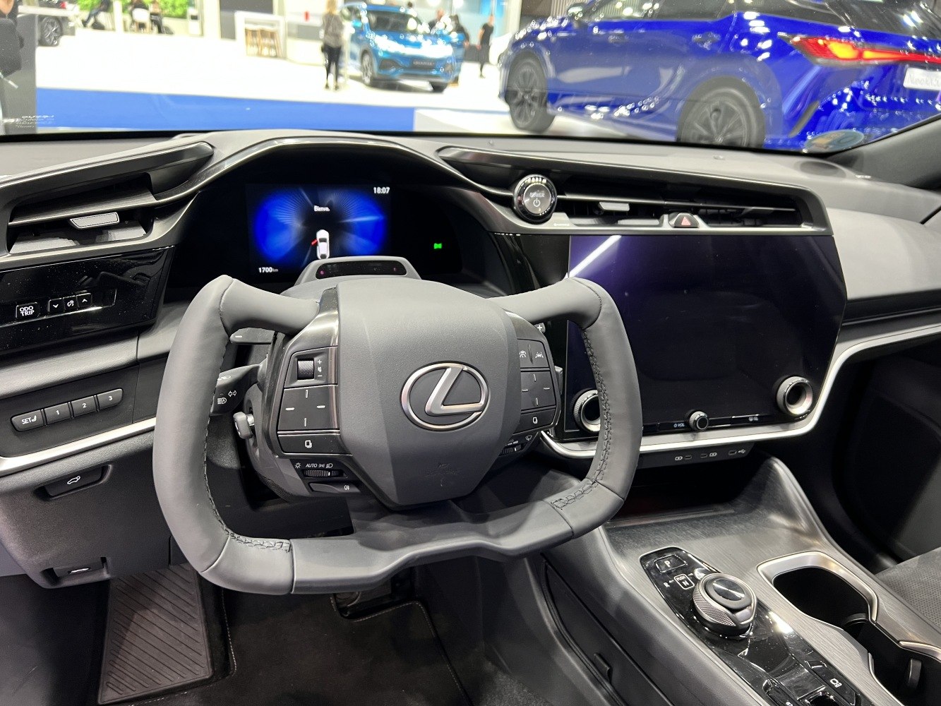 Yoke steering wheel and digital dashboard in modern electric SUV interior