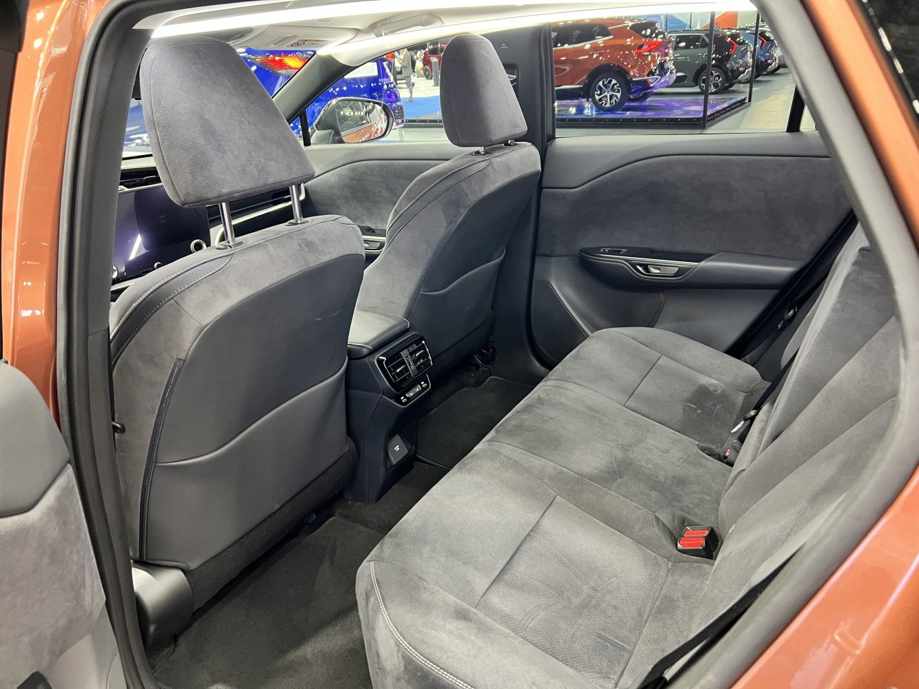 Rear seating area with premium upholstery and integrated climate control vents