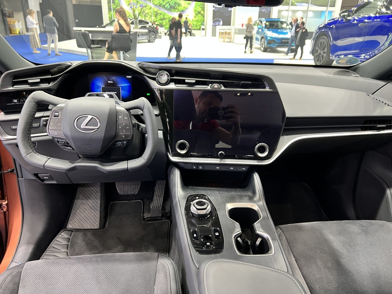 Yoke steering wheel and large central touchscreen in SUV interior