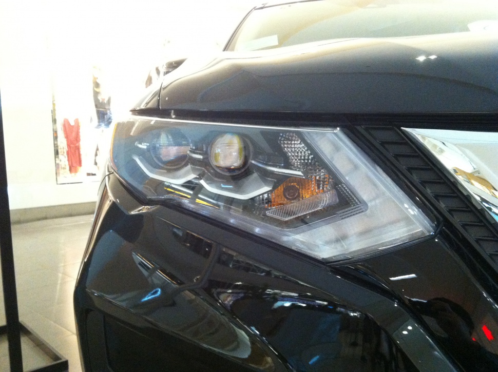 Close-up of headlight and front grille design