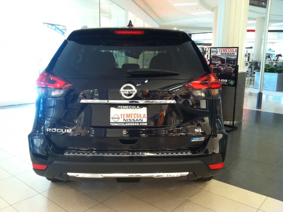 Rear view of SUV with hybrid badge and SL trim.