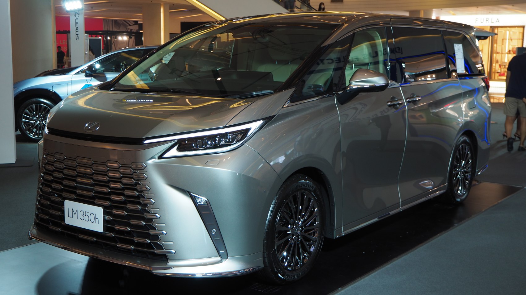 Luxury MPV with bold front grille and sleek LED headlights