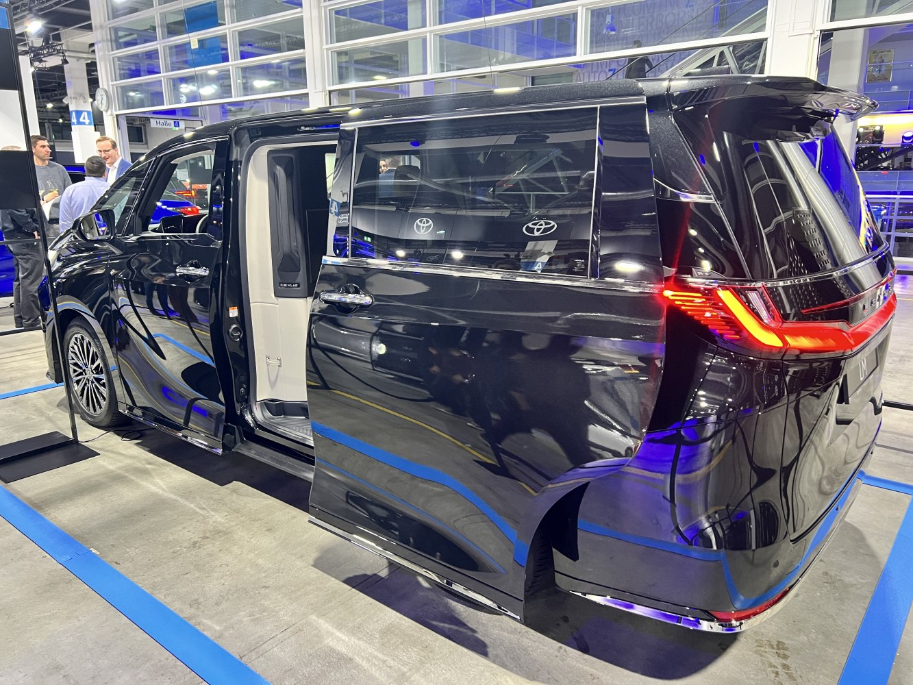 Sliding rear door and distinctive LED tail lights of a luxury minivan
