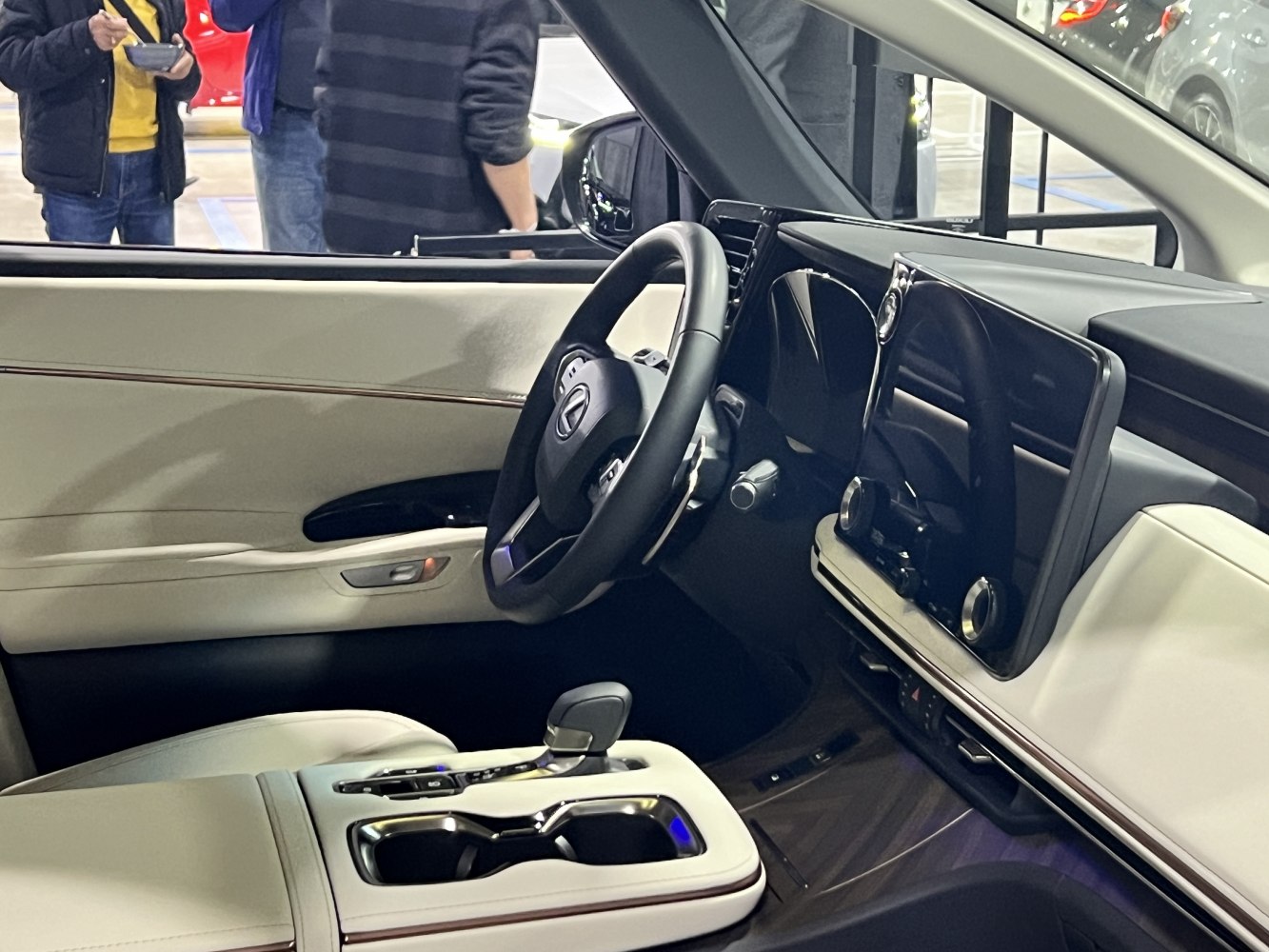 Luxury car interior with sleek dashboard and leather-wrapped steering wheel