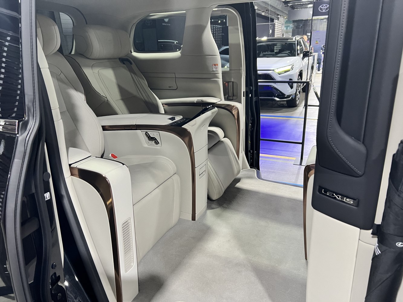Luxury rear passenger seats with advanced controls and spacious interior