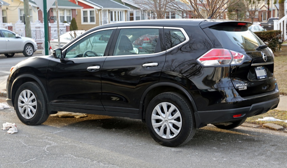 Black compact SUV side and rear view with visible tail lights and alloy wheels.