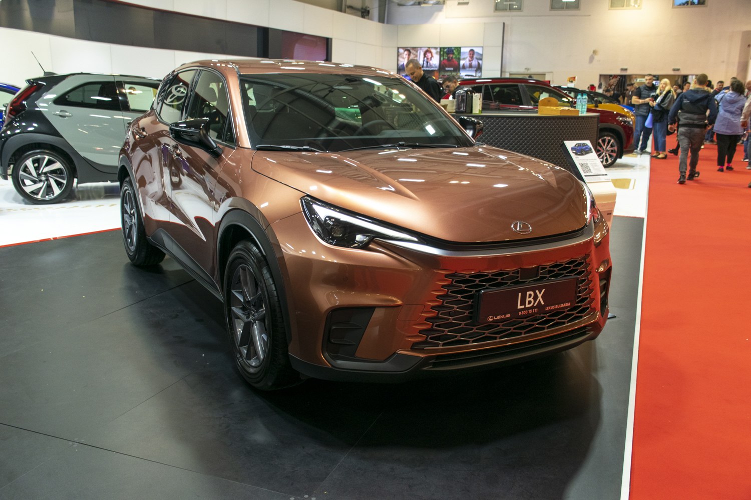 Sharp front LED headlights and large honeycomb grille on a modern SUV.