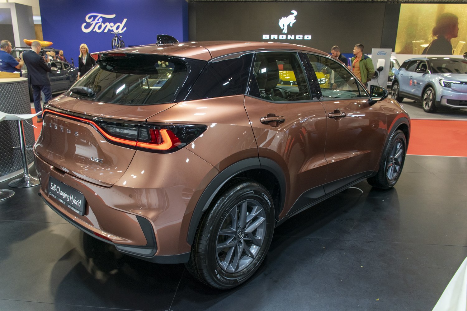 Rear three-quarter view showing hybrid badge and distinct tail light design