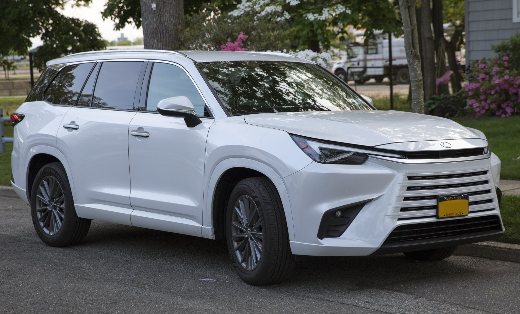 White SUV with bold grille and sharp LED headlights
