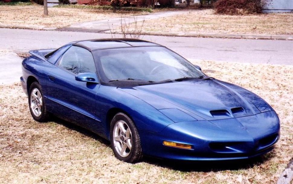 Blue sports coupe front angle with hood scoops and alloy wheels