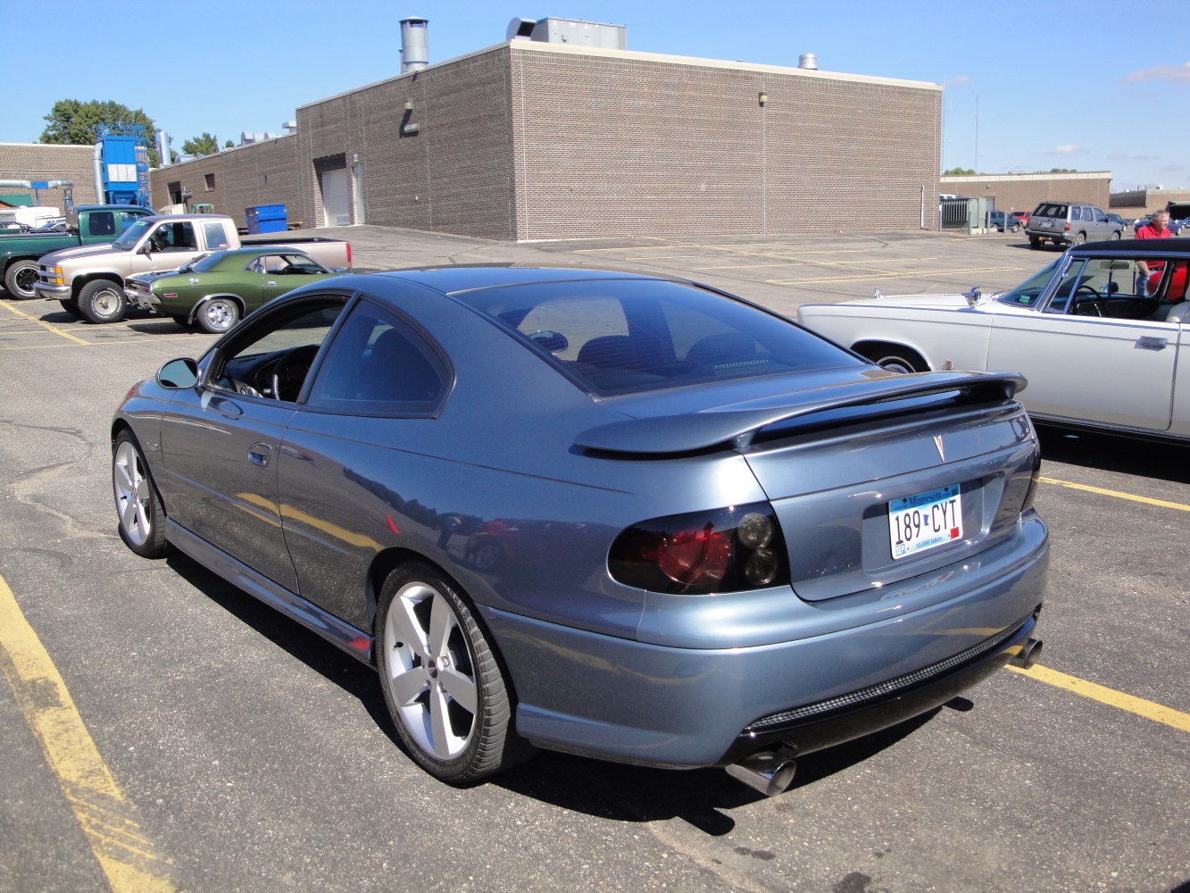 Rear view of a coupe with spoiler and tinted taillights