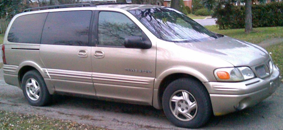 Minivan with sliding side door and five-spoke alloy wheels