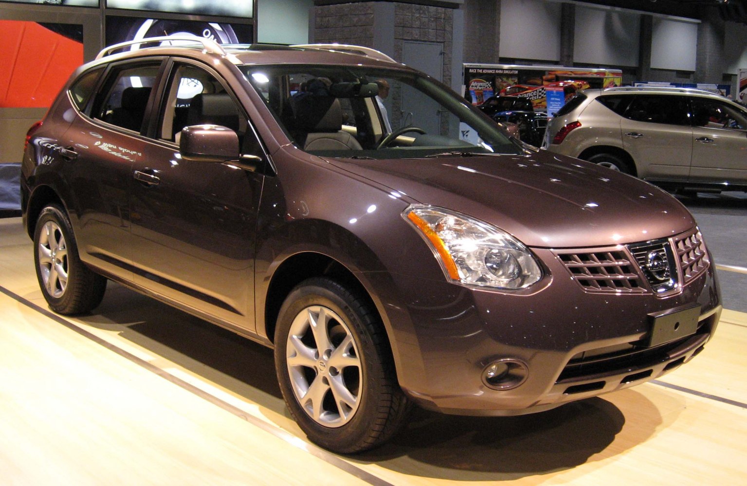 Front and side view of a compact SUV with alloy wheels and distinctive grille